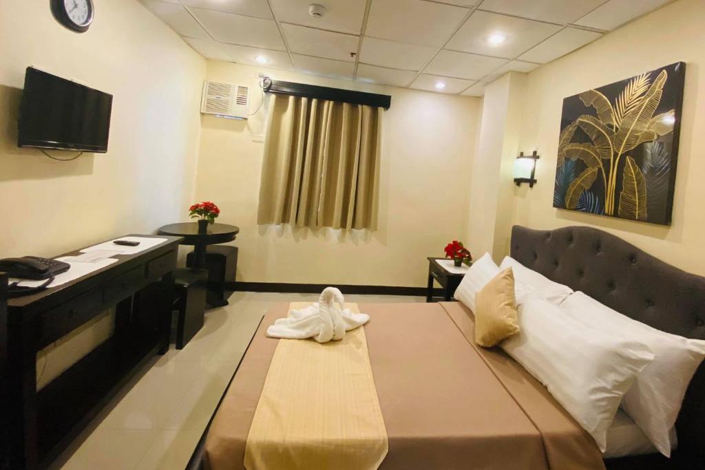 Студио (Двухместный номер-студио Делюкс с 1 кроватью) отеля Amax Inn Makati, Манила