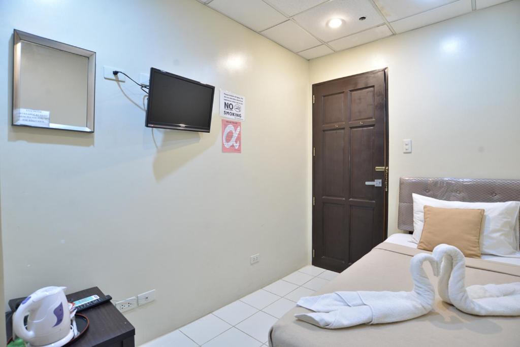 Одноместный (Стандартный одноместный номер с общей ванной комнатой) отеля Amax Inn Makati, Манила