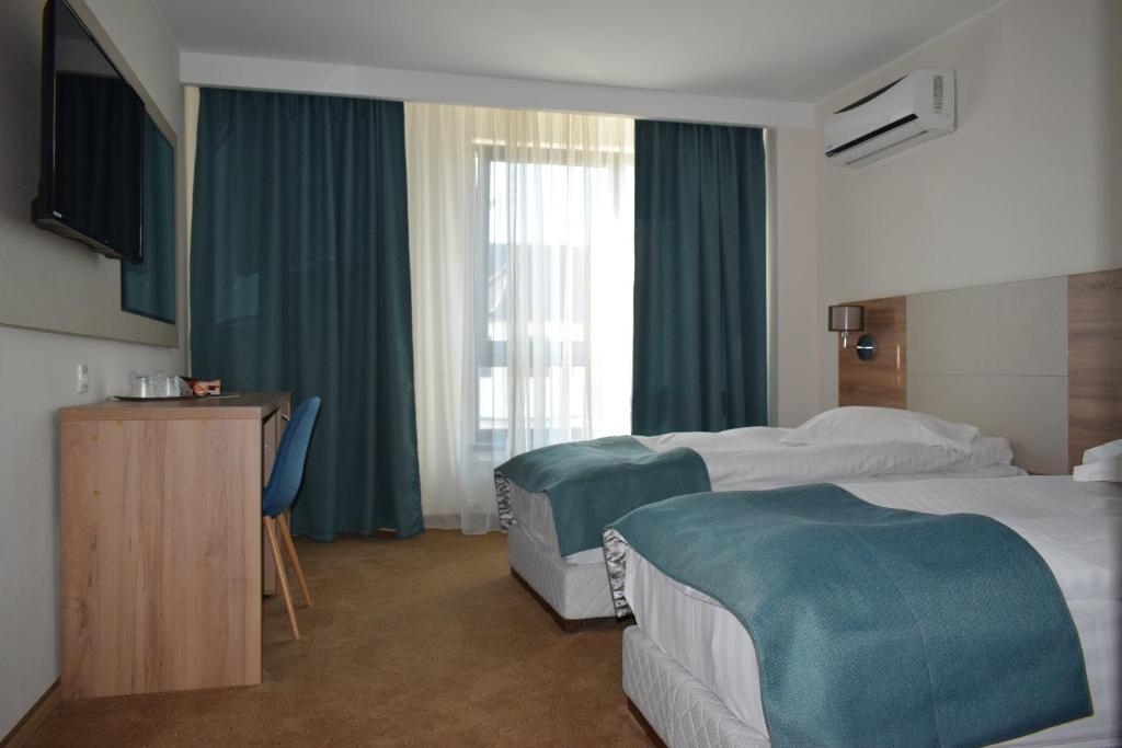 Двухместный (Двухместный номер с 2 отдельными кроватями) отеля Hotel Regal, Брашов