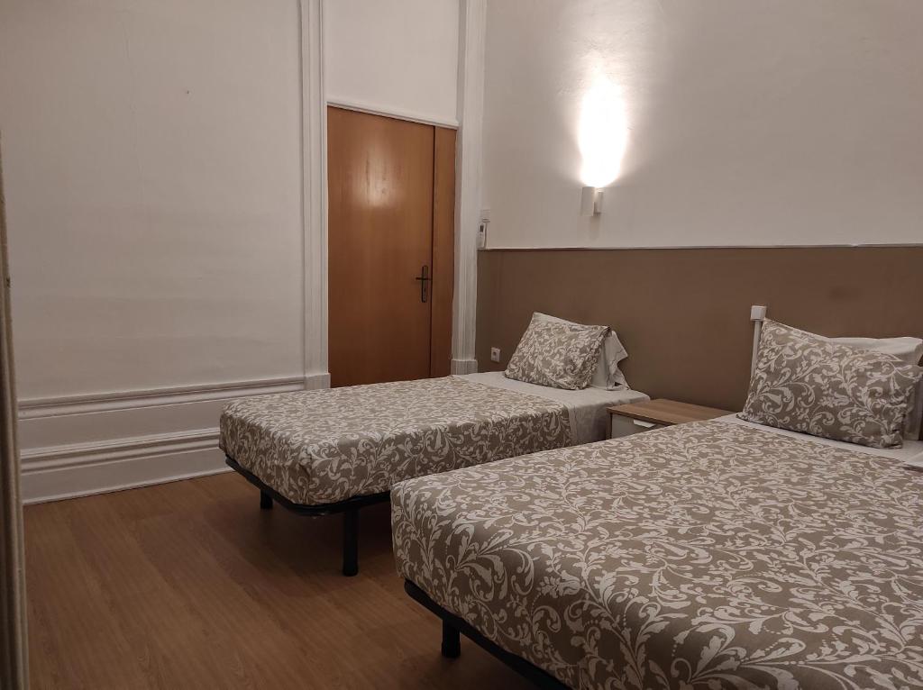 Двухместный (Двухместный номер с 1 кроватью или 2 отдельными кроватями) отеля Residencial Lira - B&B, Порту