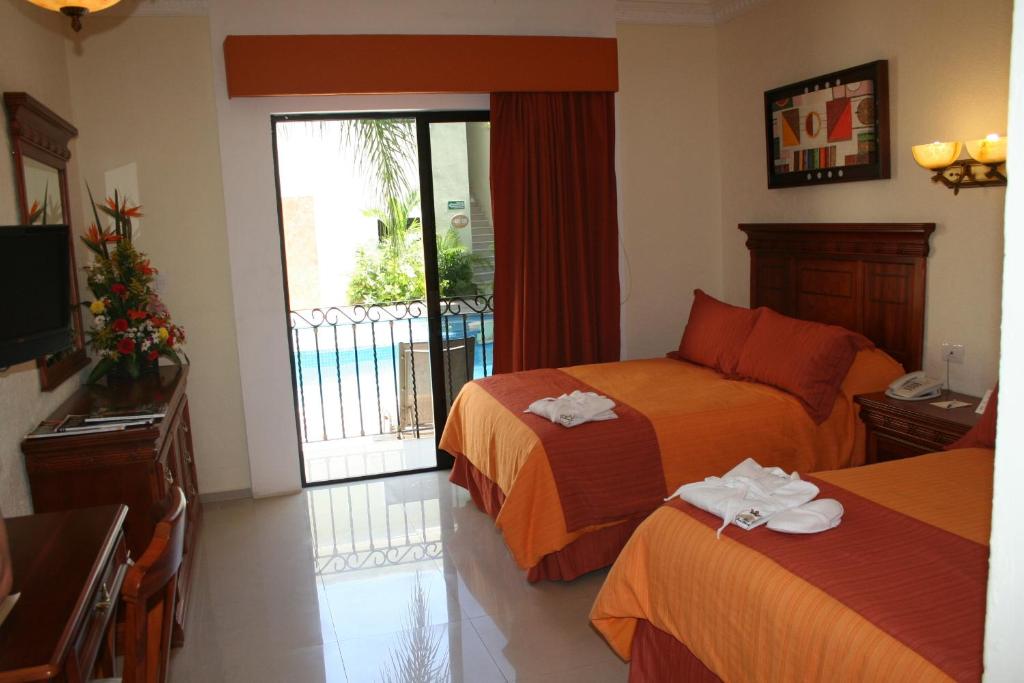 Двухместный (Delux Room Two Double Beds) отеля Gran Real Yucatan, Мерида
