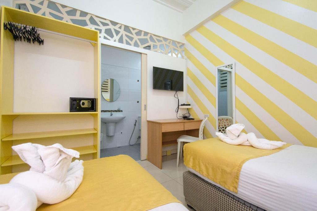 Двухместный (Двухместный номер с 2 отдельными кроватями) хостела Alicia Tower Residences, Себу