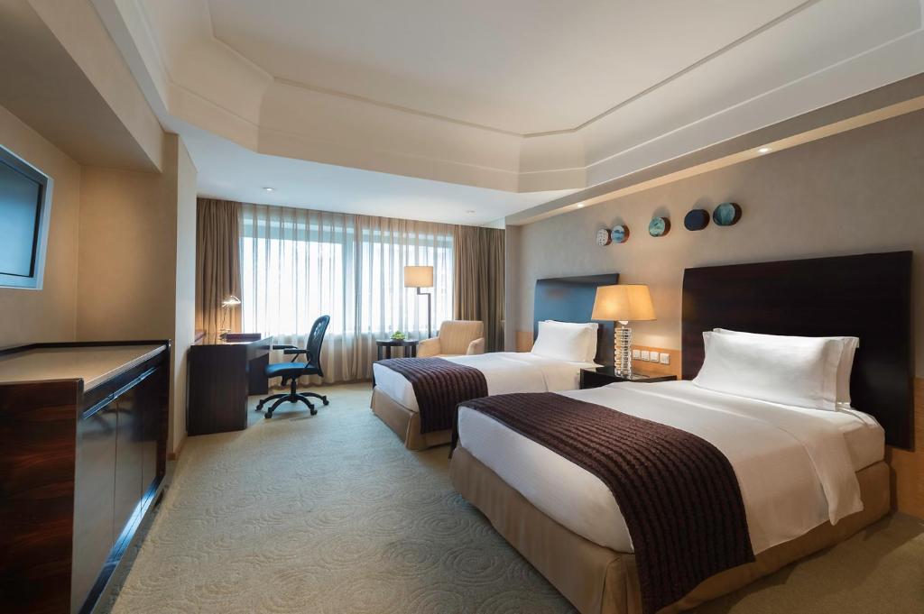 Двухместный (Улучшенный двухместный номер с 2 отдельными кроватями) отеля Marco Polo Parkside, Beijing, Пекин