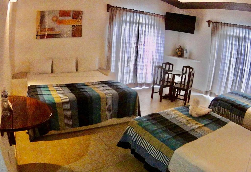 Трехместный (Улучшенный трехместный номер) отеля Hotel Bahia Huatulco, Санта-Крус-Хуатулко