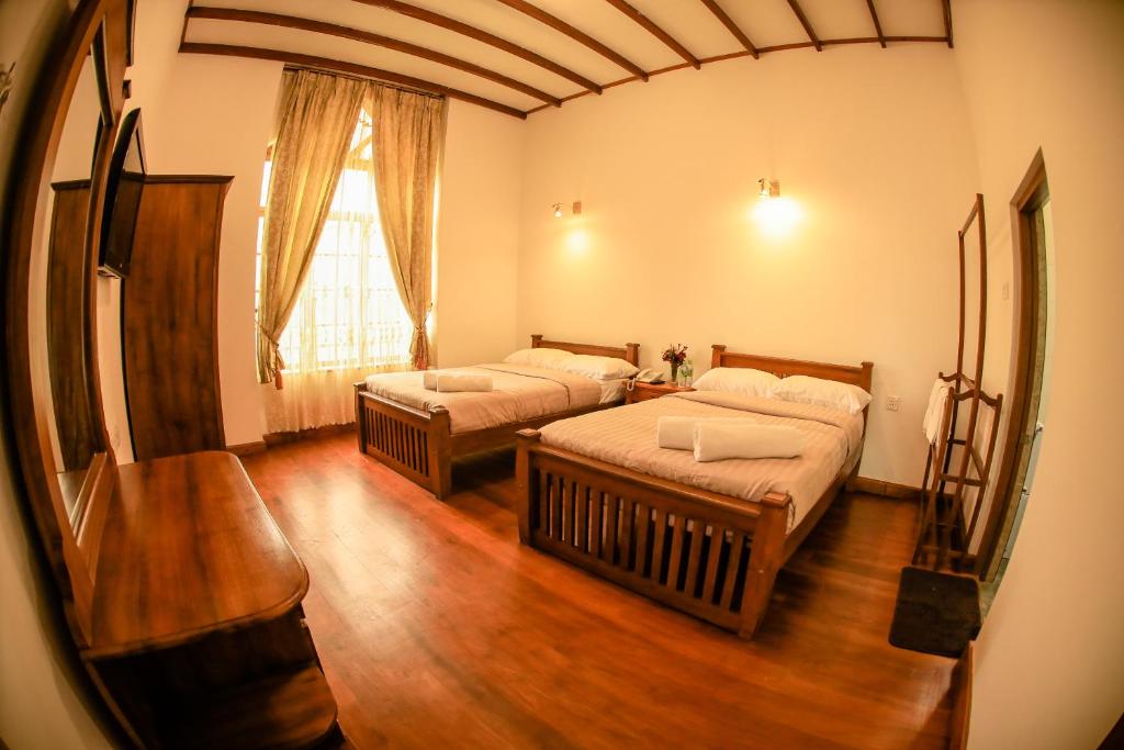 Двухместный (Двухместный номер Делюкс с 1 кроватью или 2 отдельными кроватями) отеля Bungalow By Camellia, Нувара-Элия