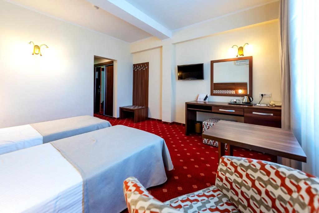 Двухместный (Улучшенный двухместный номер с 2 отдельными кроватями) отеля Hotel Minerva, Бухарест