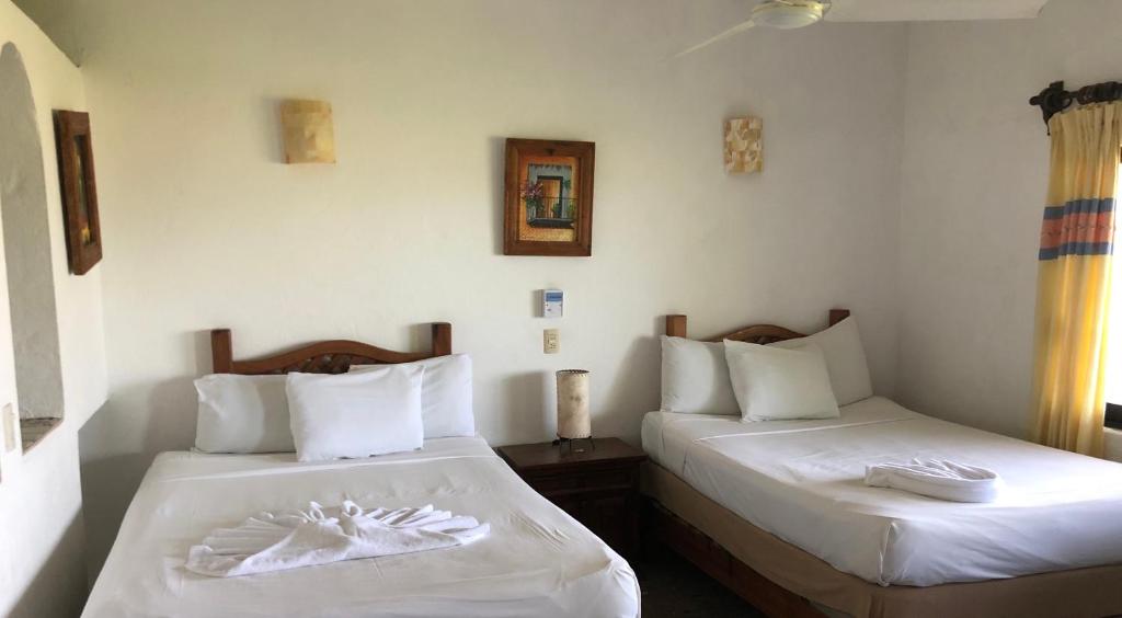 Двухместный (Двухместный номер с 1 кроватью и балконом, вид на море) отеля Hotel Arcoiris, Пуэрто-Эскондидо