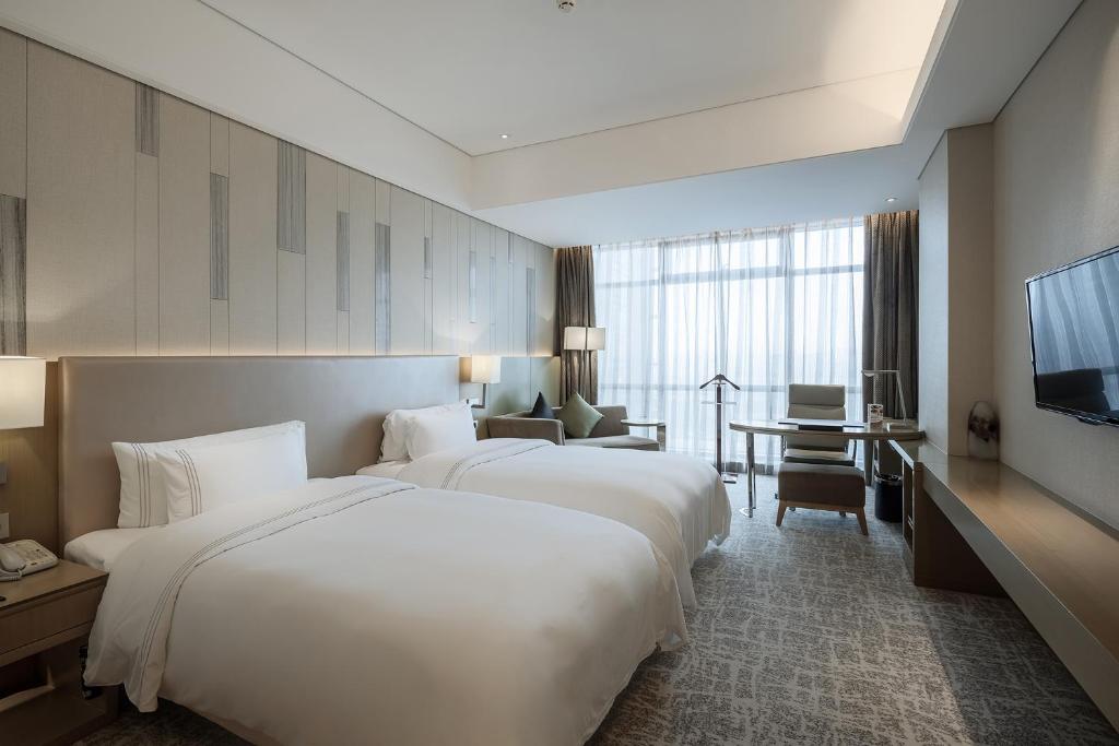 Двухместный (Улучшенный двухместный номер с 2 отдельными кроватями) отеля Hotel Nikko Suzhou, Сучжоу