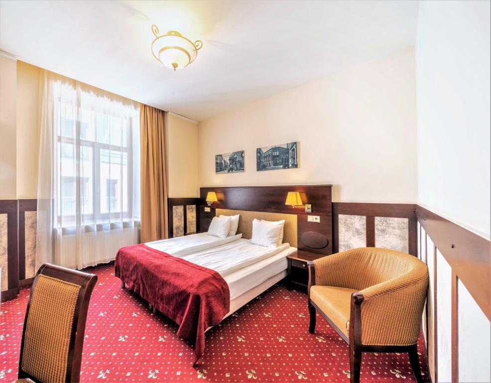 Двухместный (Стандартный двухместный номер с 1 кроватью или 2 отдельными кроватями) отеля Rixwell Old Riga Palace Hotel, Рига