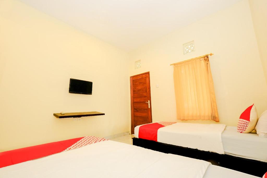 Двухместный (Стандартный двухместный номер с 2 отдельными кроватями) отеля OYO 2521 Uluwatu Cahya Guest House, Улувату