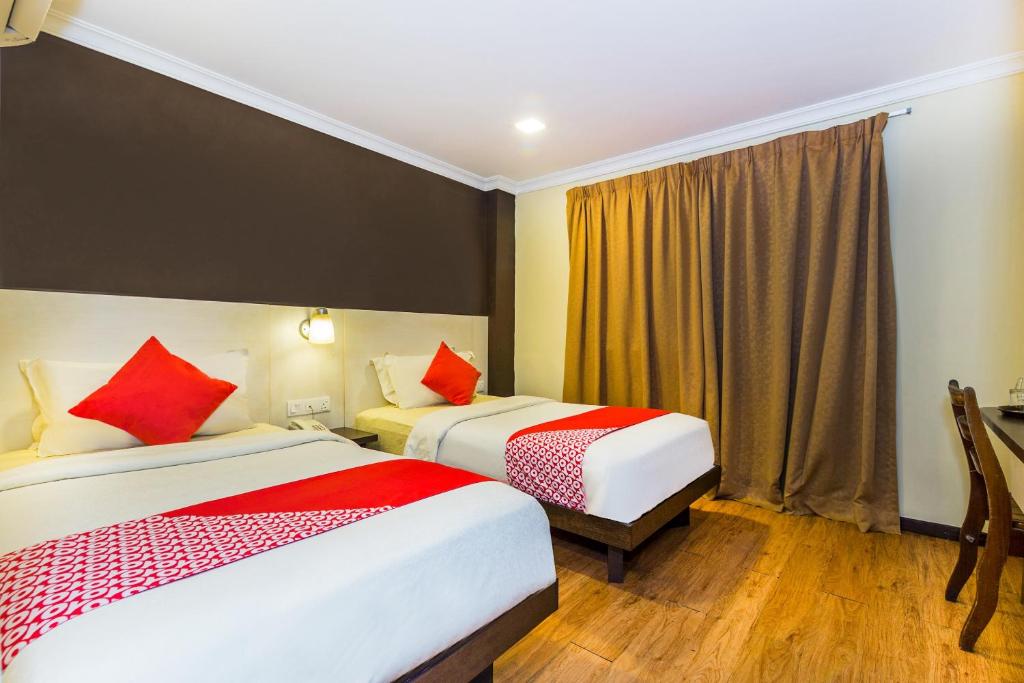 Двухместный (Стандартный двухместный номер с 2 отдельными кроватями) отеля OYO 431 Hotel De Grand Orchard, Куала-Лумпур