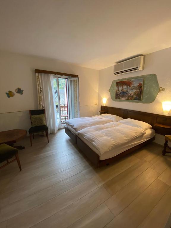 Двухместный (Двухместный номер с 1 кроватью или 2 отдельными кроватями и балконом) отеля Hotel Antico, Аскона