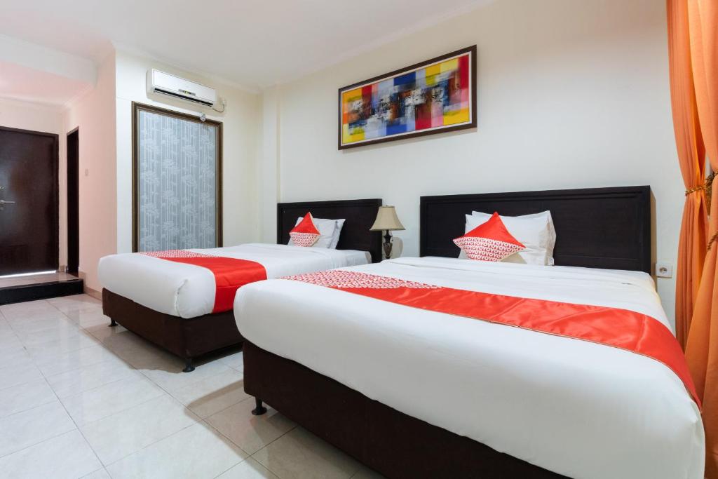 Двухместный (Стандартный двухместный номер с 2 отдельными кроватями) отеля OYO 2688 Guntur Hotel, Денпасар