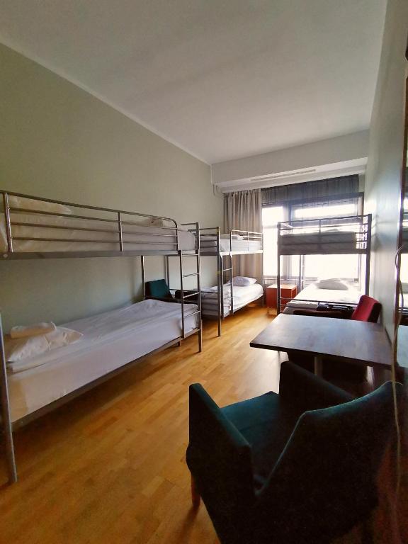 Номер (Односпальная кровать в общем номере для женщин) отеля Arkadia Hotel & Hostel, Хельсинки