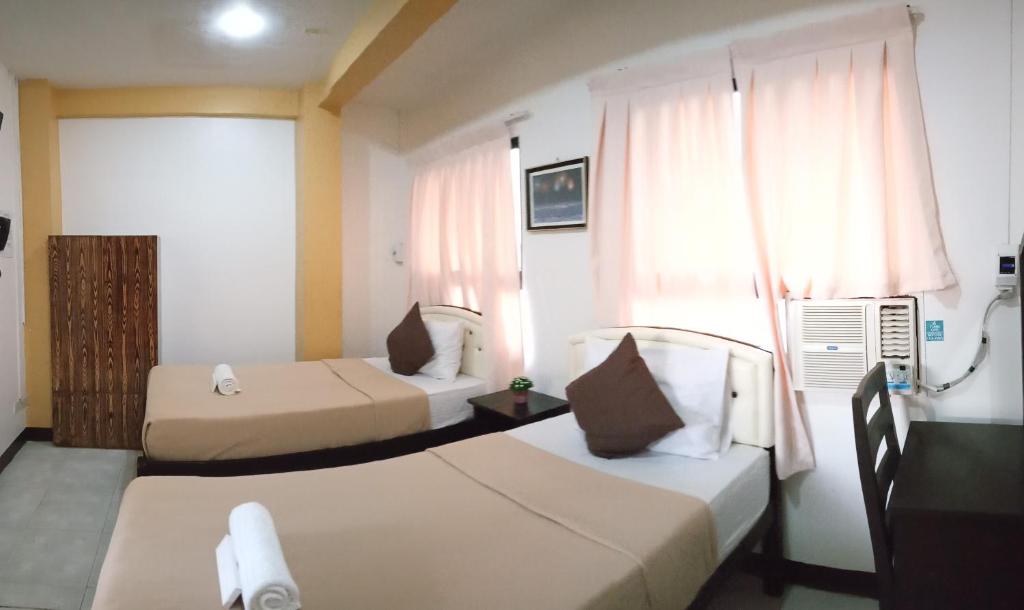 Двухместный (Стандартный двухместный номер с 2 отдельными кроватями) отеля Amax Inn Cebu, Себу