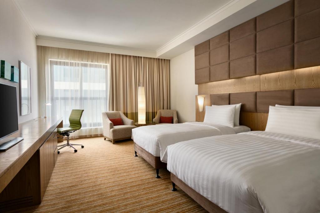 Двухместный (Улучшенный двухместный номер с 2 отдельными кроватями) отеля Traders Hotel Qaryat Al Beri Abu Dhabi, by Shangri-La, Абу-Даби