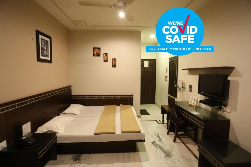 Двухместный (Улучшенный двухместный номер с 1 кроватью или 2 отдельными кроватями) отеля Smyle Inn, Нью-Дели