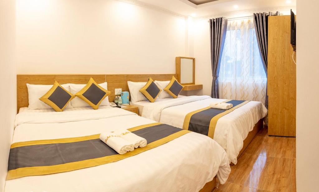 Четырехместный (Номер Делюкс с 2 кроватями размера «queen-size») отеля SODA HOTEL, Далат