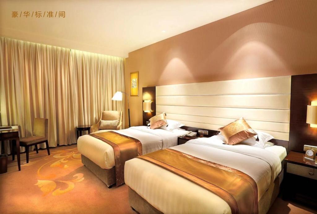 Двухместный (Представительский двухместный номер с 2 отдельными кроватями) отеля Ritan Hotel Downtown Beijing, Пекин