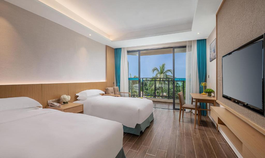 Двухместный (Роскошный двухместный номер с 2 отдельными кроватями) отеля Sanya South China Hotel, Санья