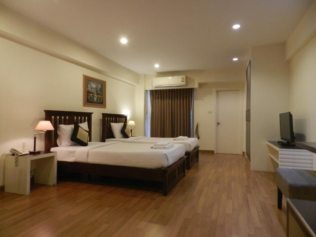 Двухместный (Двухместный номер Делюкс с 1 кроватью или 2 отдельными кроватями) отеля Nanatai Suites, Бангкок