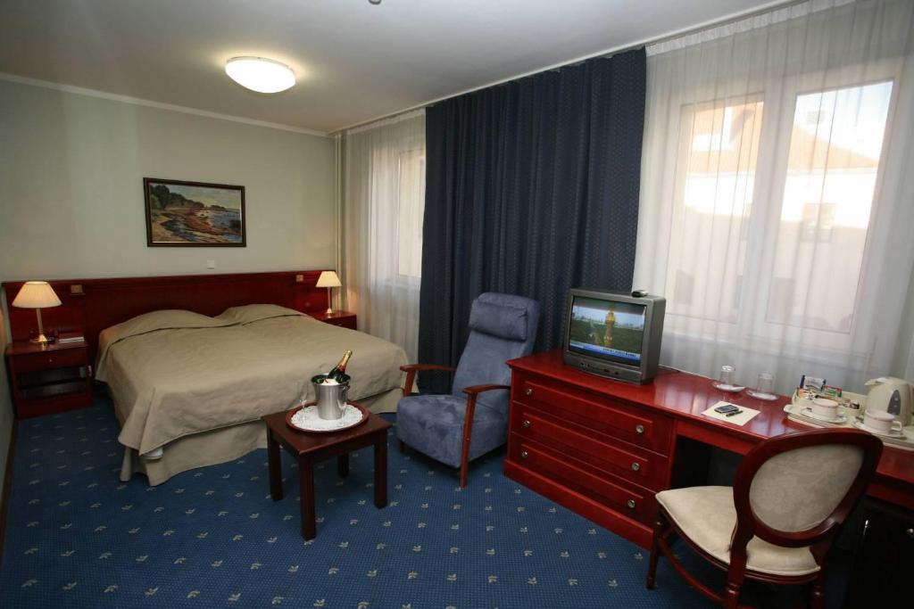 Двухместный (Улучшенный двухместный номер с 1 кроватью или 2 отдельными кроватями и сауной) отеля Draakon Hotel, Тарту