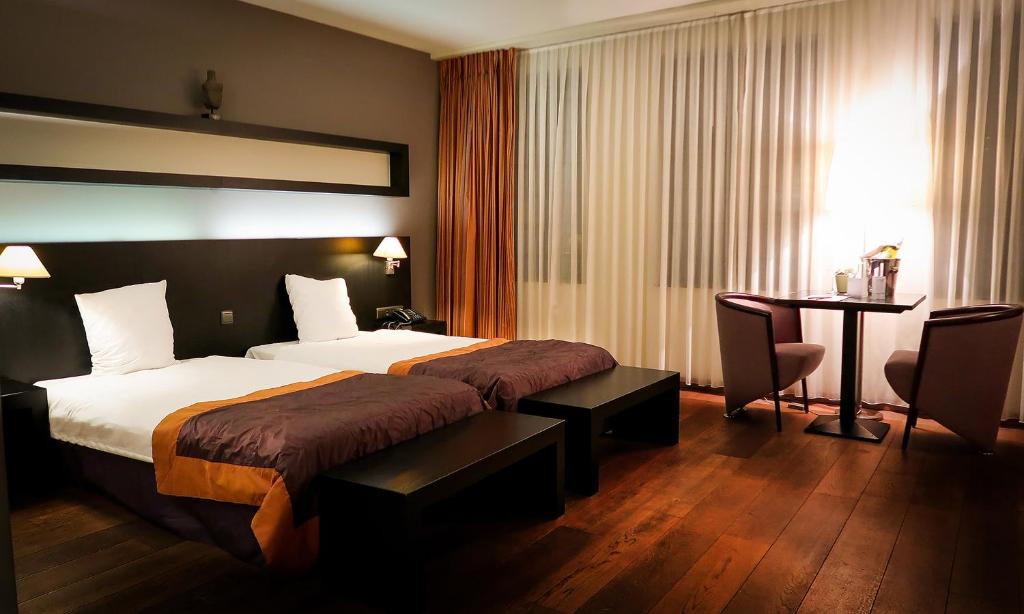 Двухместный (Двухместный номер Делюкс с 1 кроватью) отеля Hotel Van Eyck, Маасейк