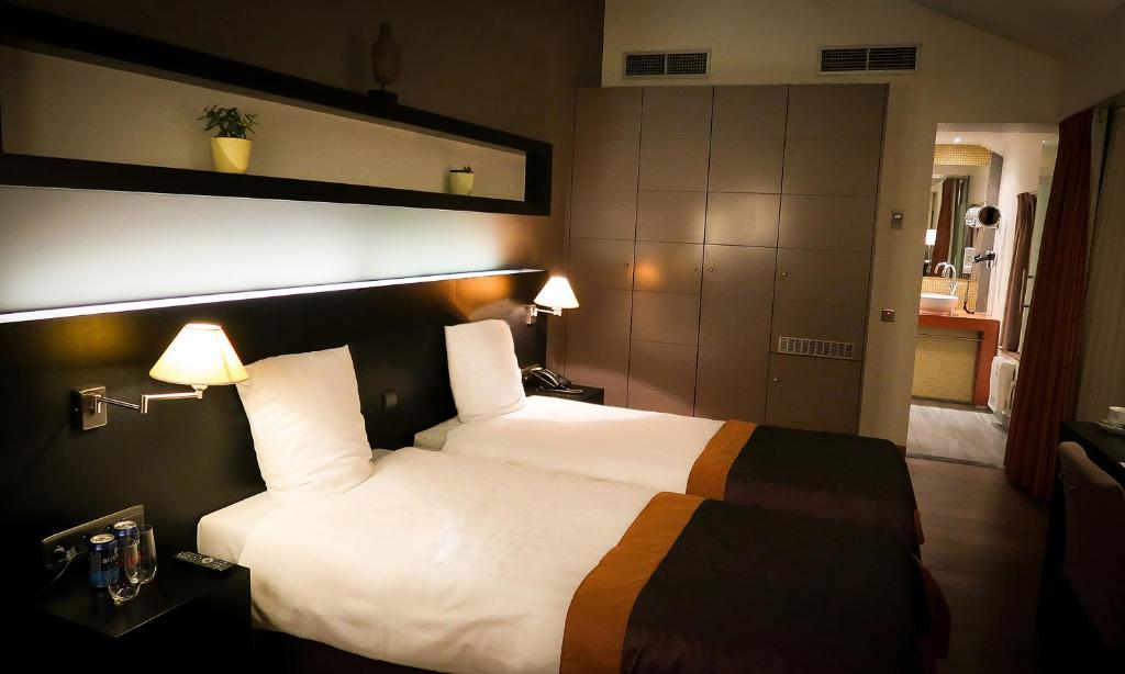 Двухместный (Стандартный двухместный номер с 2 отдельными кроватями) отеля Hotel Van Eyck, Маасейк