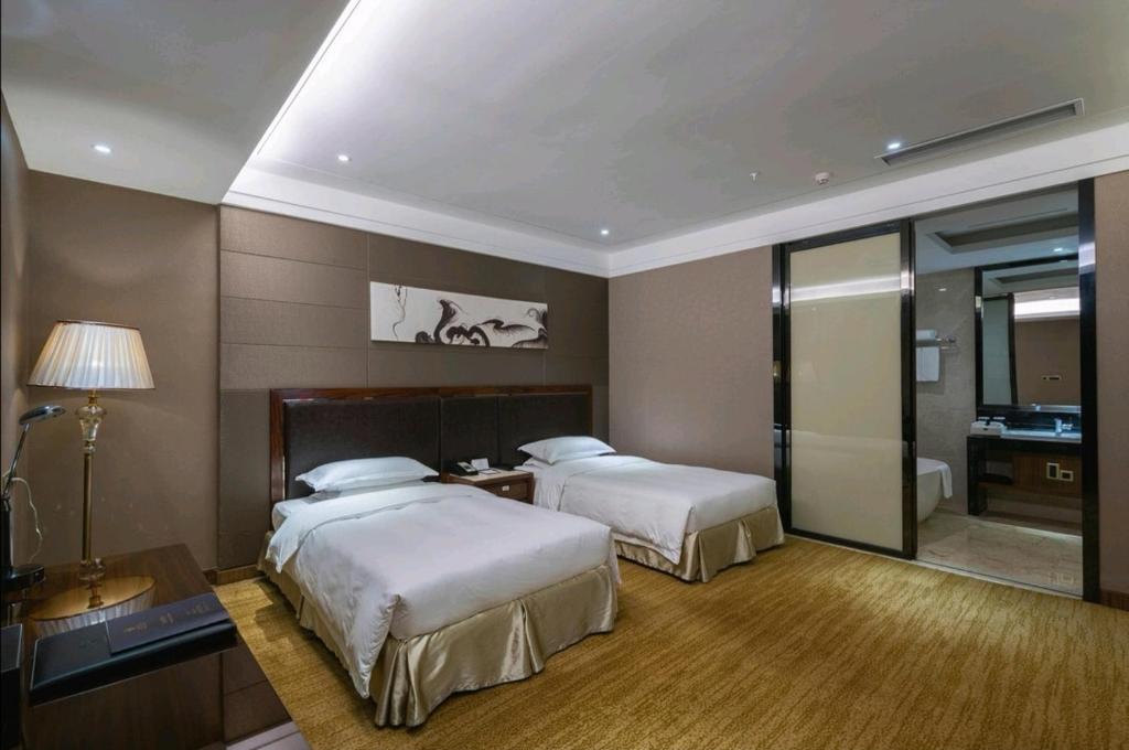 Двухместный (Бюджетный двухместный номер с 2 отдельными кроватями) отеля Honder International Hotel, Гуанчжоу