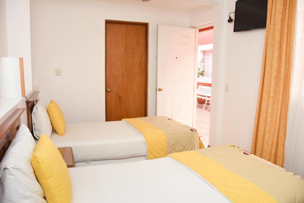 Двухместный (Двухместный номер с 2 односпальными кроватями) отеля Hotel Camba, Оахака-де-Хуарес