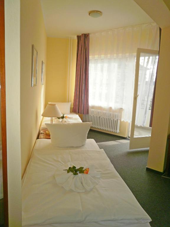 Четырехместный (Четырехместный номер с общей ванной комнатой) отеля Hotel Amadeus Central, Берлин