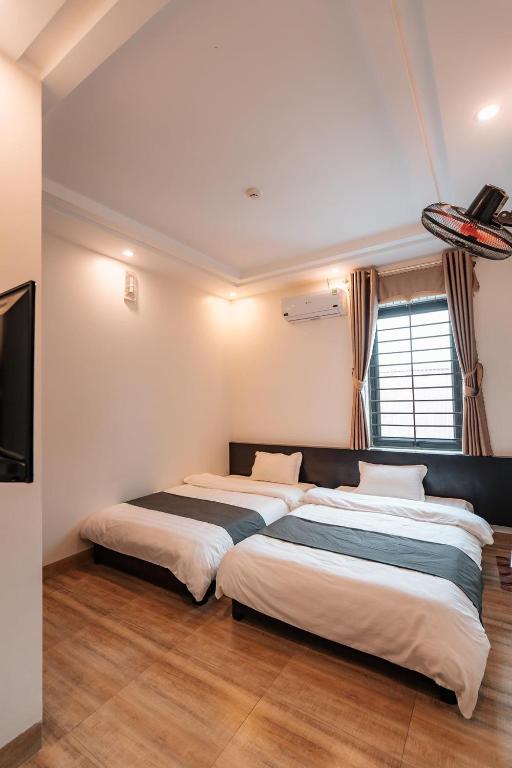 Двухместный (Улучшенный двухместный номер с 2 отдельными кроватями) отеля Ha Giang Cozy Hostel, Хазянг