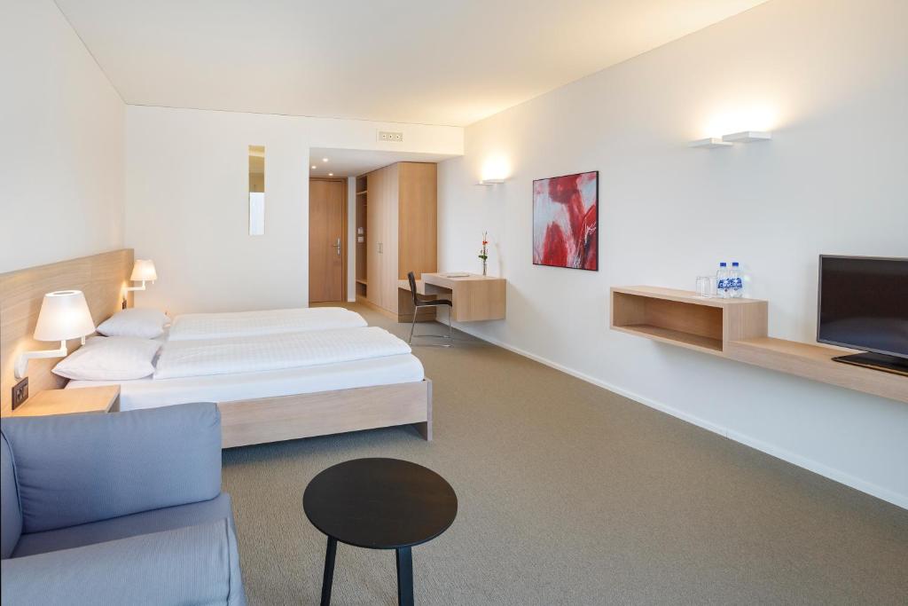 Двухместный (Улучшенный двухместный номер с 2 отдельными кроватями) отеля Newstar Swiss Quality Hotel, Санкт-Галлен