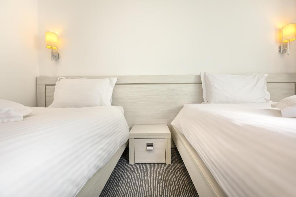 Двухместный (Двухместный номер с 2 отдельными кроватями) отеля Alex&George Boutique Hotel, Клуж-Напока