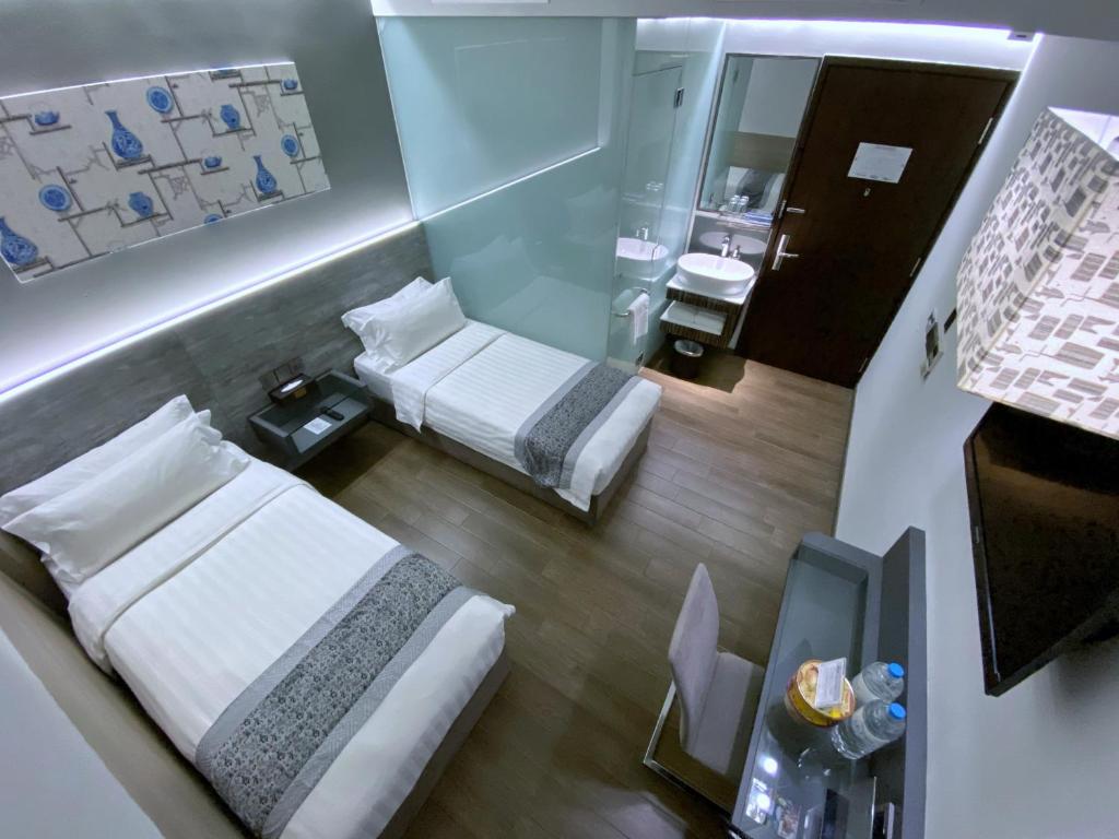 Двухместный (Улучшенный двухместный номер с 2 отдельными кроватями) отеля Bliss Hotel Singapore, Сингапур (город)