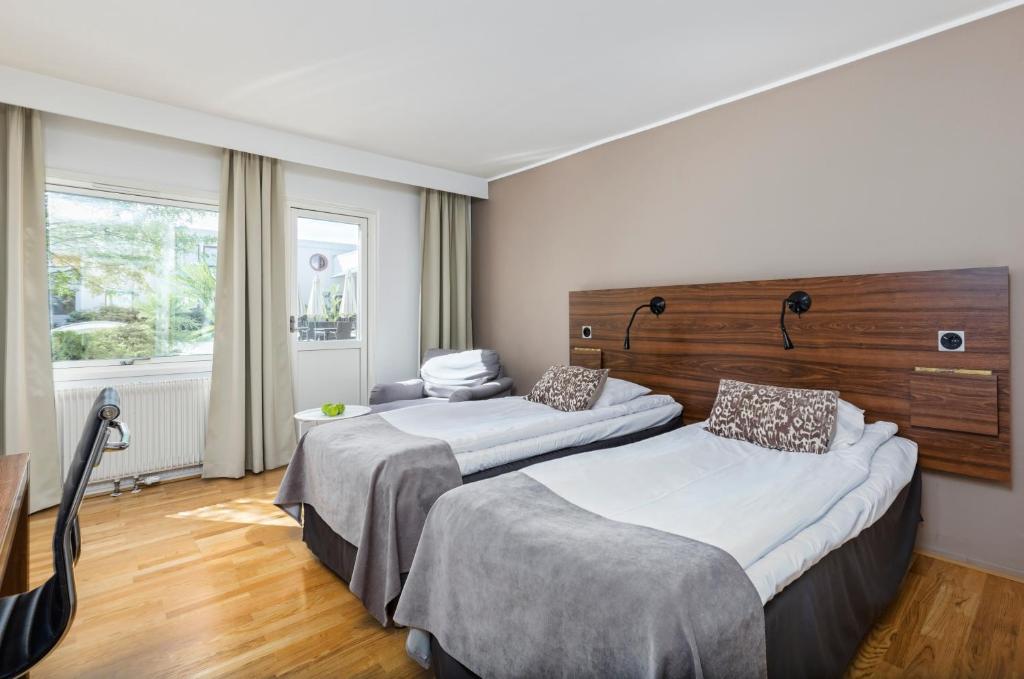 Двухместный (Двухместный номер с 2 отдельными кроватями и патио) отеля Apple Hotel & Konferens Göteborg, Гетеборг