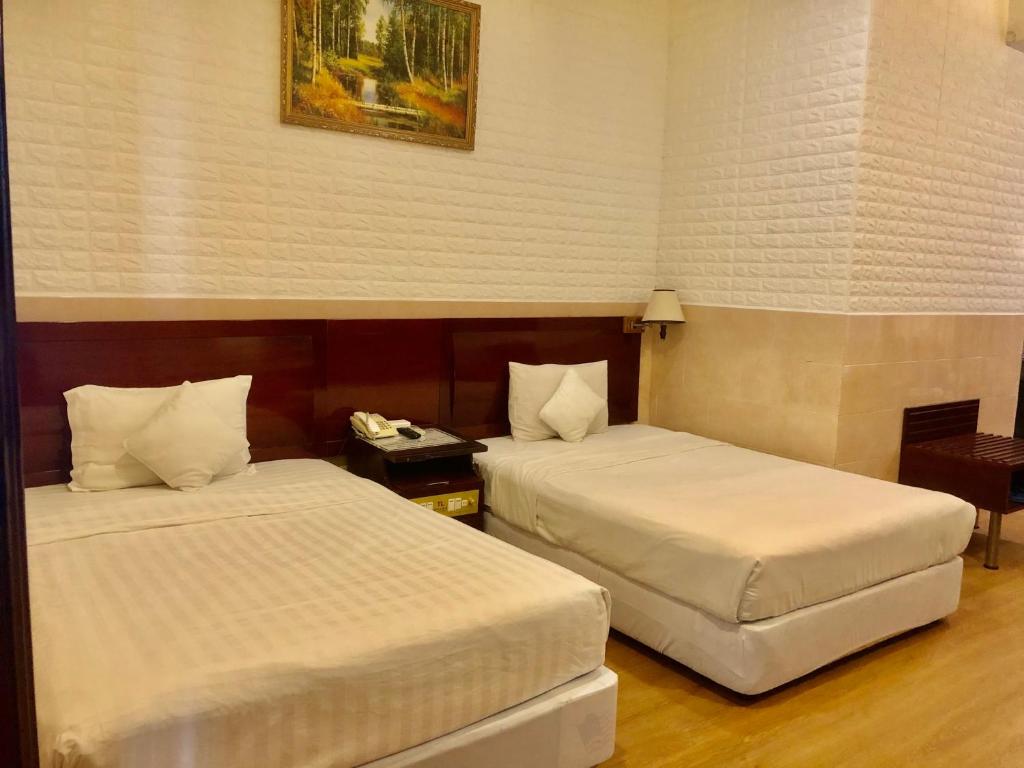 Двухместный (Улучшенный двухместный номер с 2 отдельными кроватями) отеля Thang Loi Hotel, Хошимин