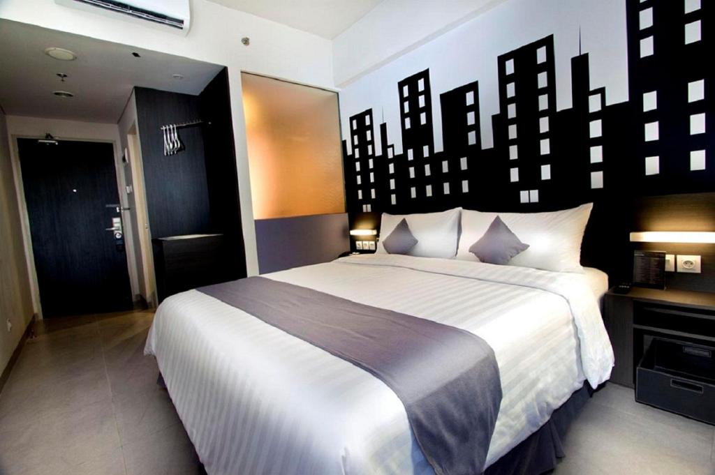 Двухместный (Стандартный двухместный номер с 1 кроватью или 2 отдельными кроватями) отеля Neo Hotel Tendean Jakarta by ASTON, Джакарта