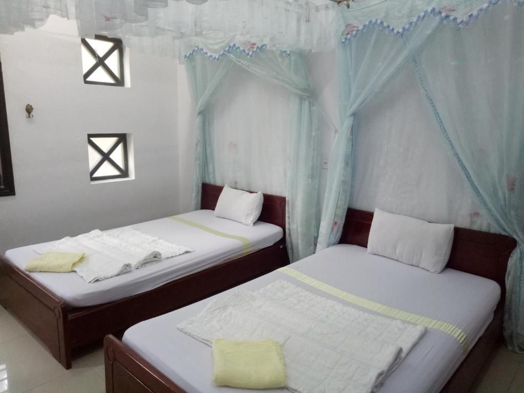 Двухместный (Двухместный номер с 2 отдельными кроватями) гостевого дома Quang Nam Guest, Тамки