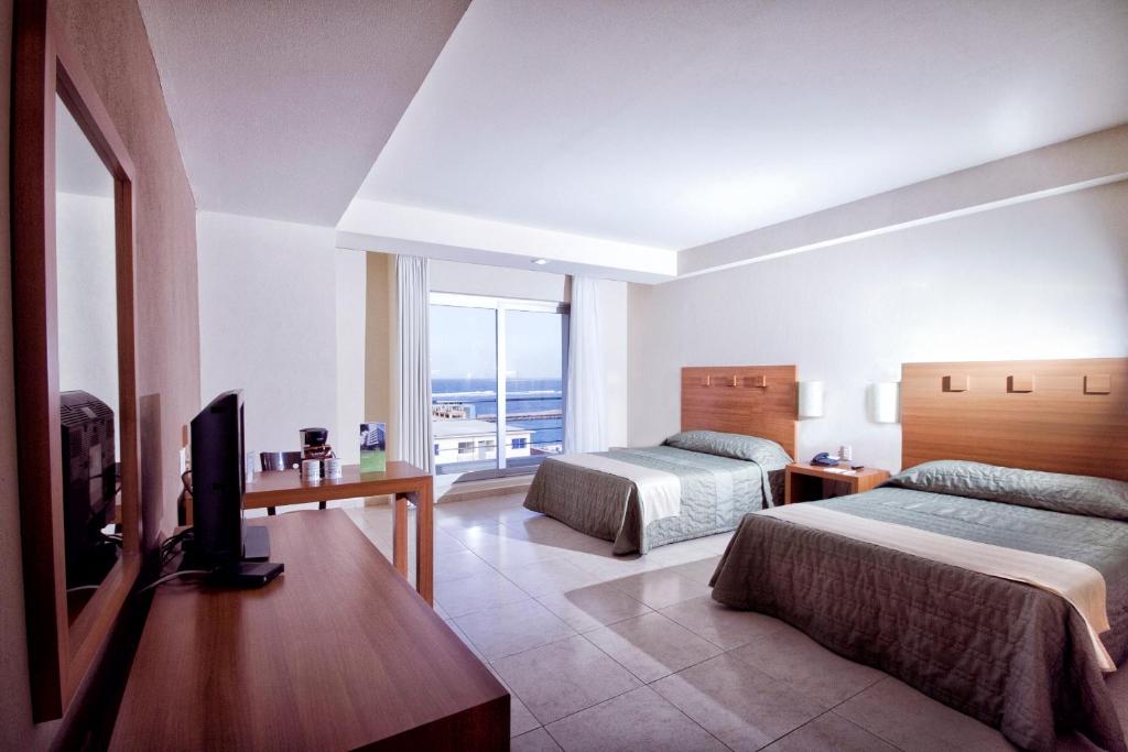 Двухместный (Стандартный двухместный номер с 2 отдельными кроватями) отеля Balaju Hotel & Suites, Веракрус