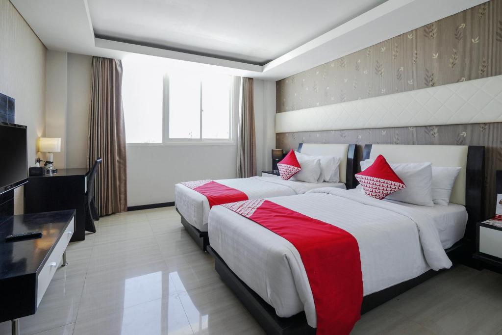 Двухместный (Стандартный двухместный номер с 2 отдельными кроватями) отеля OYO 499 Princess Keisha Hotel & Convention Center, Денпасар