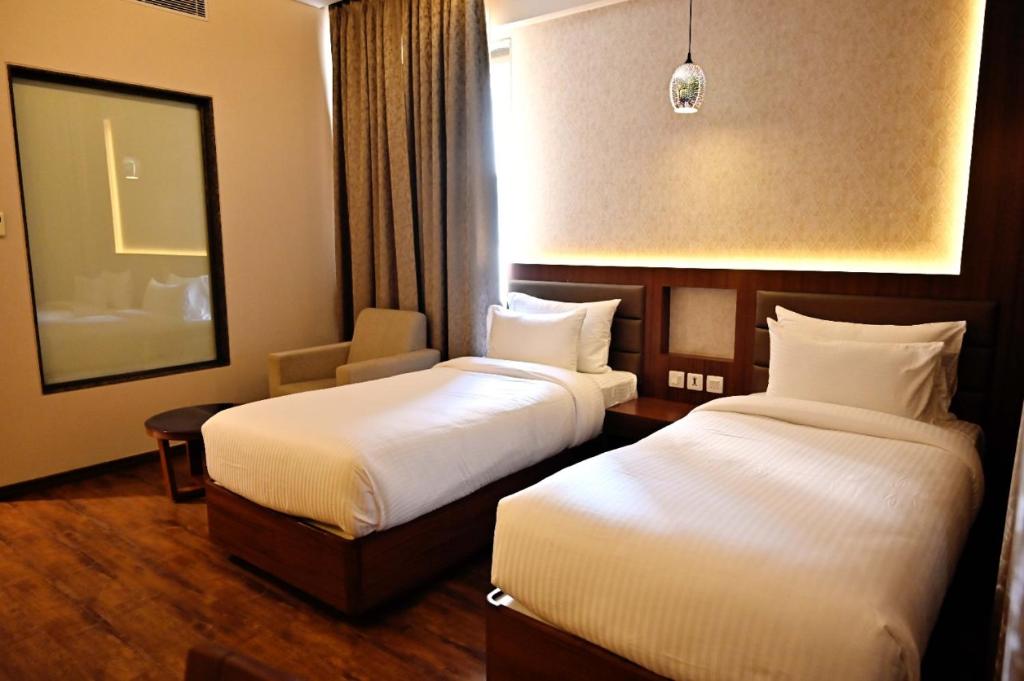 Двухместный (Двухместный номер Делюкс с 1 кроватью или 2 отдельными кроватями) отеля Pristine Hotel, Varanasi, Варанаси