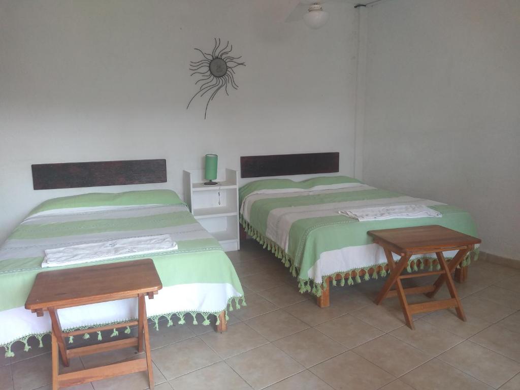 Двухместный (Двухместный номер с 2 двуспальными кроватями) отеля La Casa del Volcan, Тлайякапан