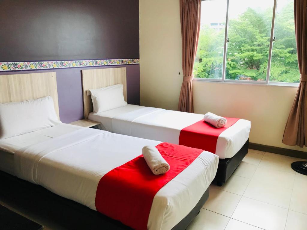 Двухместный (Двухместный номер Делюкс с 2 отдельными кроватями) отеля OYO 497 ESQ Ferringhi Hotel, Пенанг