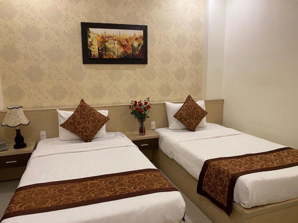 Двухместный (Стандартный двухместный номер с 2 отдельными кроватями) отеля HOA MY HOTEL, Дананг