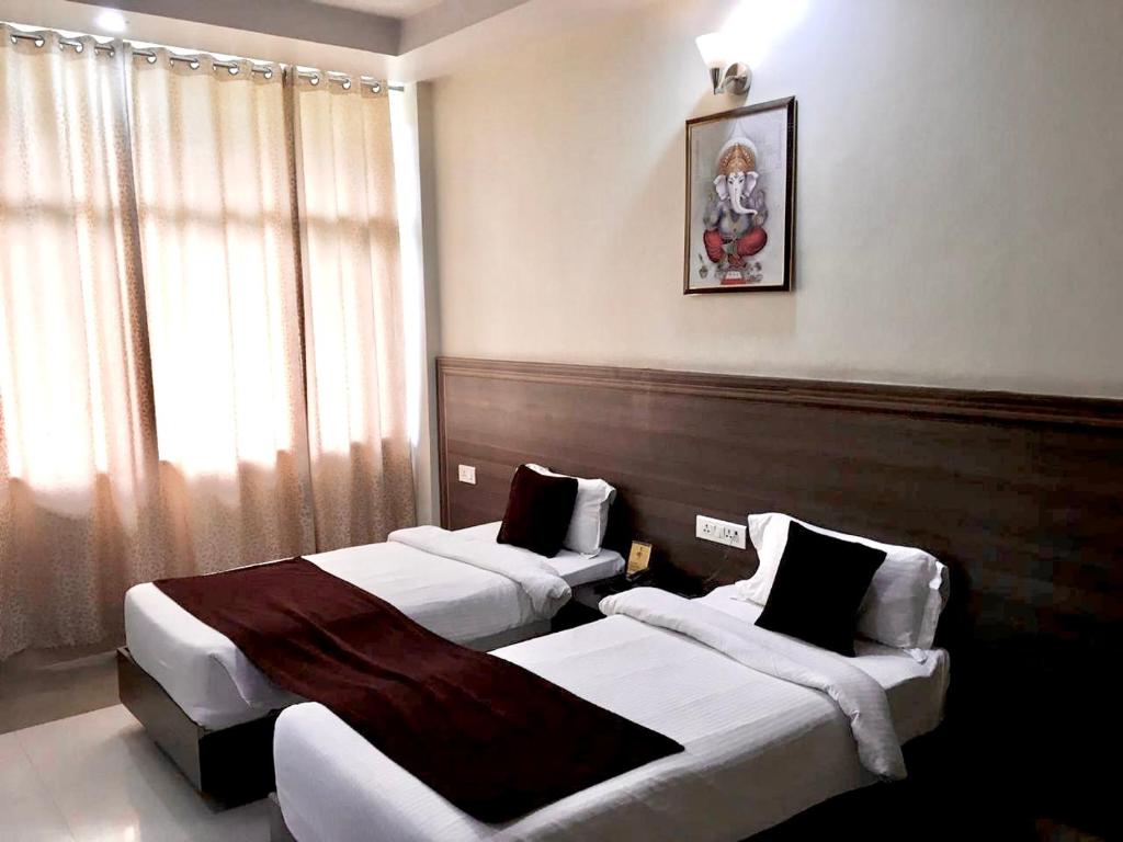 Двухместный (Двухместный номер Делюкс с 2 отдельными кроватями) отеля Hotel Trihari, Ришикеш