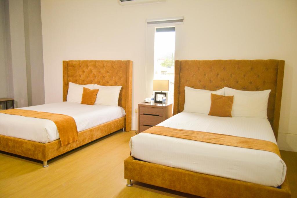 Четырехместный (Двухместный номер с 2 двуспальными кроватями (4 взрослых)) отеля Hotel Real Junchavín, Комитан-де-Домингес