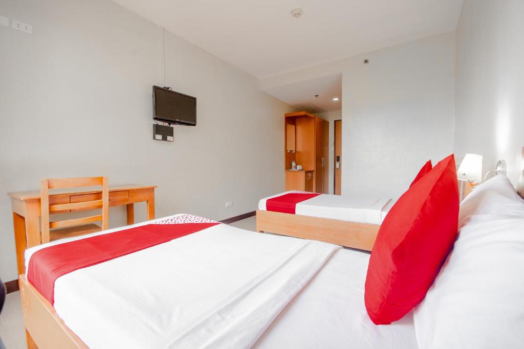 Двухместный (Двухместный номер Делюкс с 2 отдельными кроватями) отеля Fuente Oro Business Suites, Себу