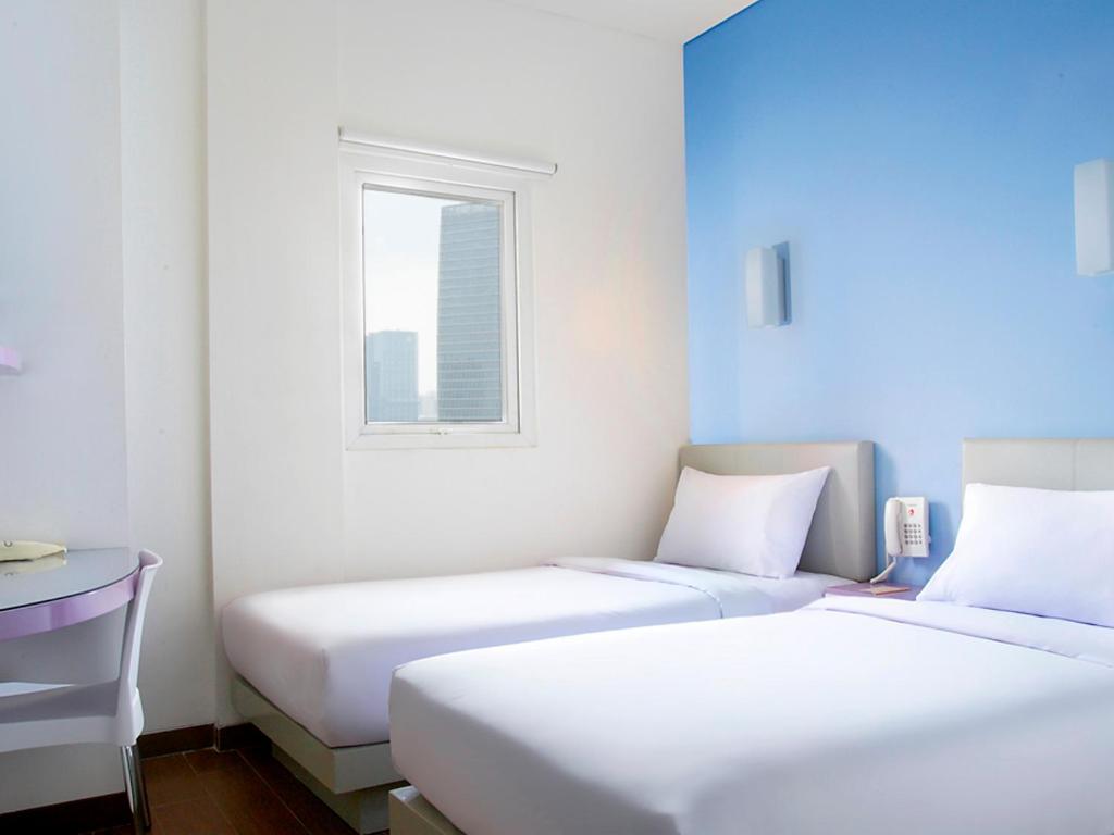 Двухместный (Двухместный номер «Смарт» с 2 отдельными кроватями) отеля Amaris Hotel Panglima Polim 2, Джакарта