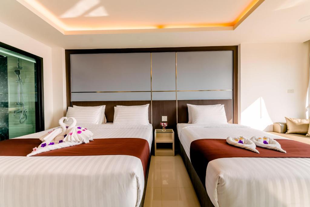 Двухместный (Двухместный номер Делюкс с 1 кроватью или 2 отдельными кроватями и видом на бассейн) отеля The Proud Hotel Pattaya, Паттайя